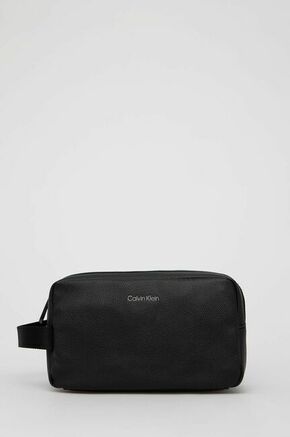 Calvin Klein - Kozmetička torbica - crna. Kozmetička torbica iz kolekcije Calvin Klein. Model izrađen od ekološke kože.